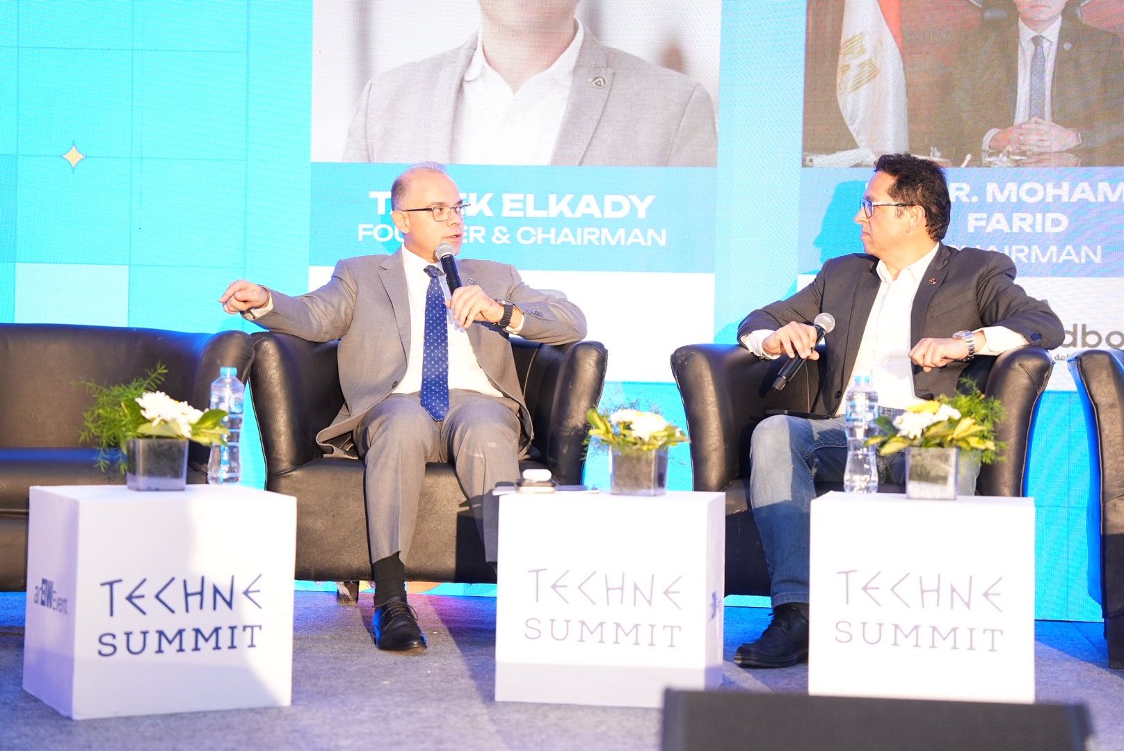 Tarek El Kady moderating a discussion with Dr. Mohamed Farid at Techne Summit